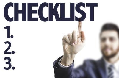 Businessman pointing at checklist