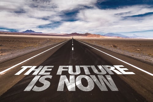 The Future is Now written on desert road